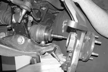 Connect the upper ball joint and install new nut; torque to 85 ft-lbs.