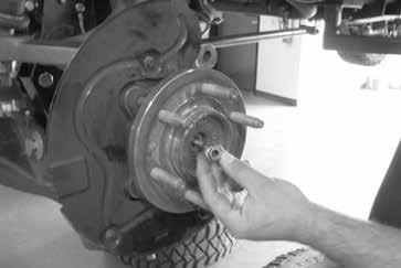 47. Install the dust shield and torque to 14 ft-lbs. Install CV shaft nut and torque to 35 ft-lbs.