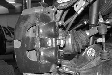 50. Reinstall the original brake rotor, followed by the brake caliper.