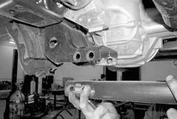 While supporting the differential, remove the two upper differential mount bolts and remove the differential and axles from the vehicle. Save the hardware.
