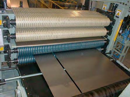 The outside of the belts catches oiled coil surface, while the inside of the belts generate tension due to the friction force acting against the sliding-metal parts.