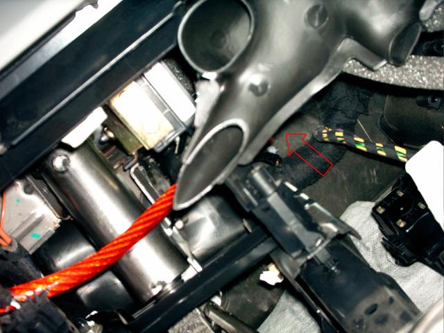 by three or four screws). You ll find the cable next to the throttle (arrow in the picture below).