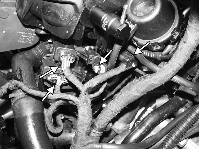 97) Reconnect the three electrical connectors on the left side of the intake manifold.