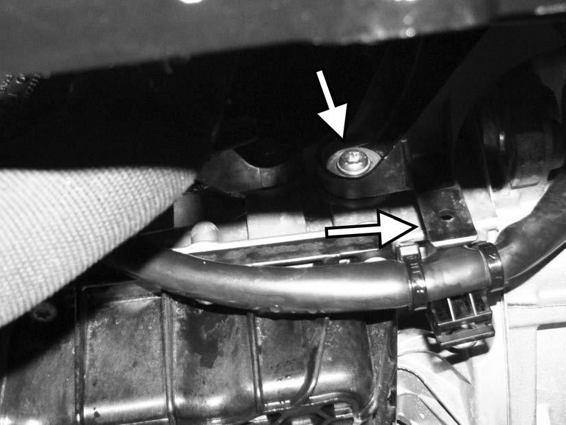 106) Underneath the car, reinstall the T30 screw holding the bottom of the turbo outlet
