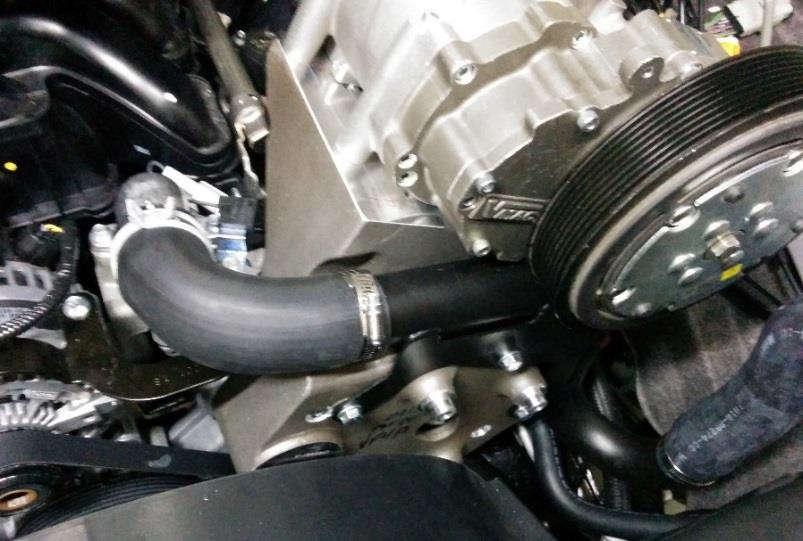 Install the modified upper radiator hose B between the upper portion of the radiator