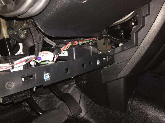 If routing the cables along the doorsill, a notch may need to be cut into the sill where the cable enters from the control box. Remove the dashboard panel below the steering wheel.