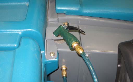 The solution tank provides a water/solution supply for the spray nozzle. A wand is included with the spray nozzle.