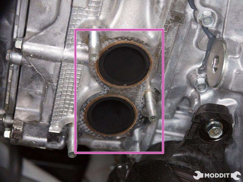 the exhaust manifold studs are clean and free of debris.
