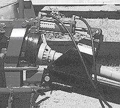 Fig. 3 HYDRAULIC CYLINDER If your machine is equipped with the optional hy draulic cylinder, use this procedure: a. Use a clean rag and wipe clean the area around the couplers. b.