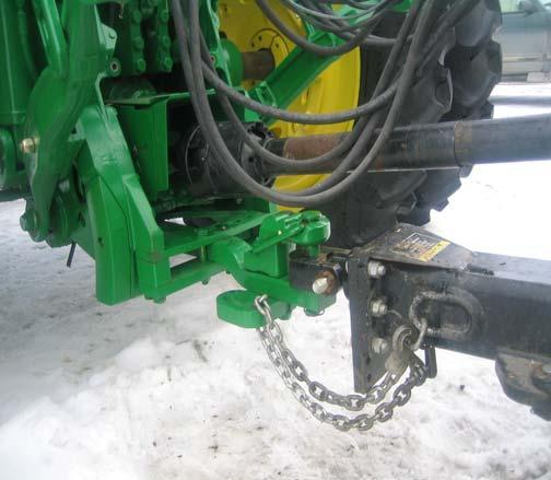 11.6 ATTACHING DEFOLIATOR TO TRACTOR DRAWBAR 1. Adjust tractor drawbar (see 11.3). 2. Remove tractor hitch pin. 3. Install required bushings into pull plate. 4. Adjust hitch height. 5.