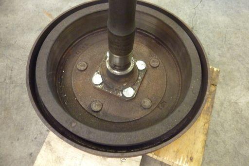 Drive the hub stud into place with a hammer. Repeat the process on the remaining (3) studs.