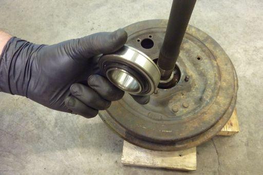 Then position the backing plate on the axle.