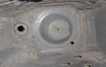 (A) is the factory shock hole that the upper plate and mounting bracket will be
