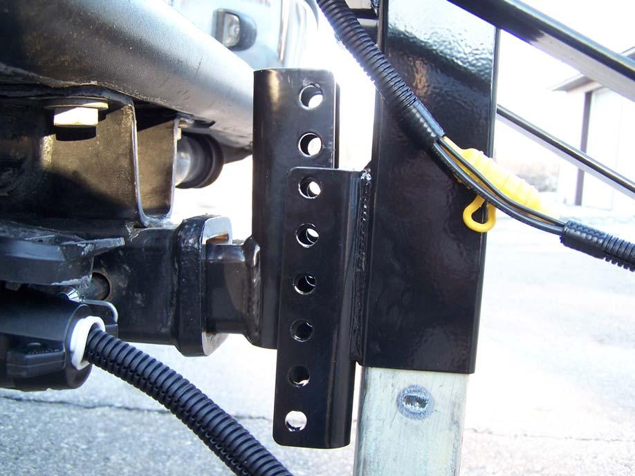 Secure the dual height adjustment pins attaching