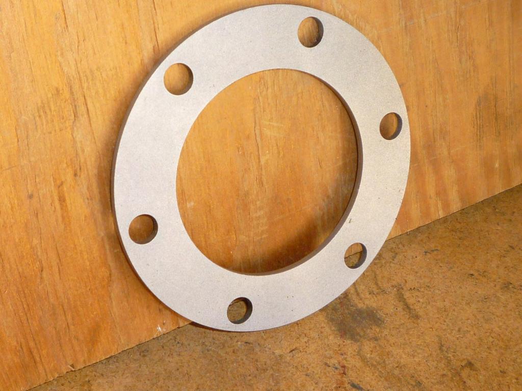 This is the bearing retainer that fits between the banjo flange and the adapter plate.