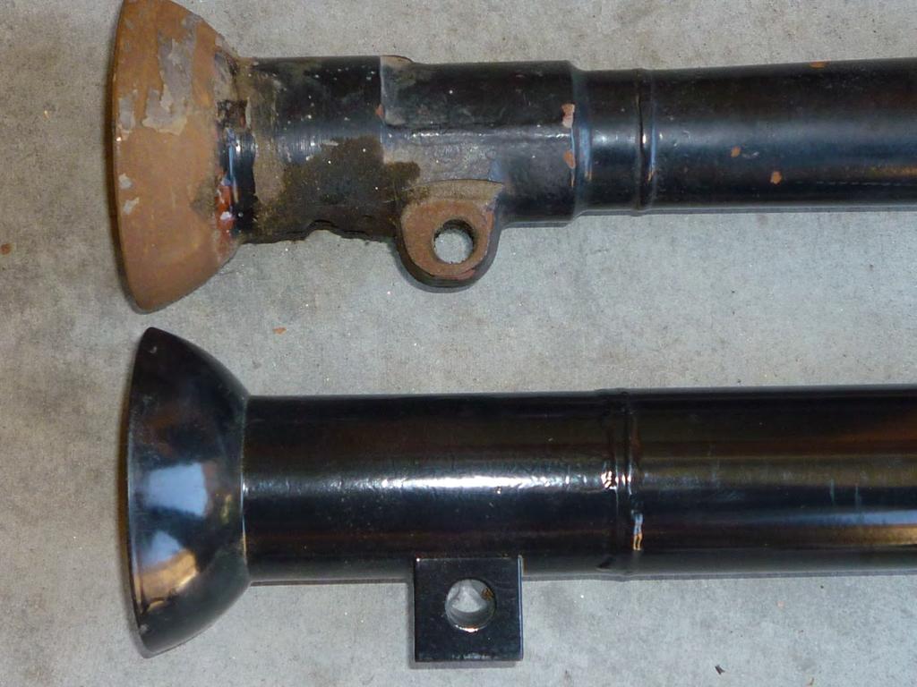 This photo shows a comparison of the radius rod mounting holes for the Ryan overdrive and a