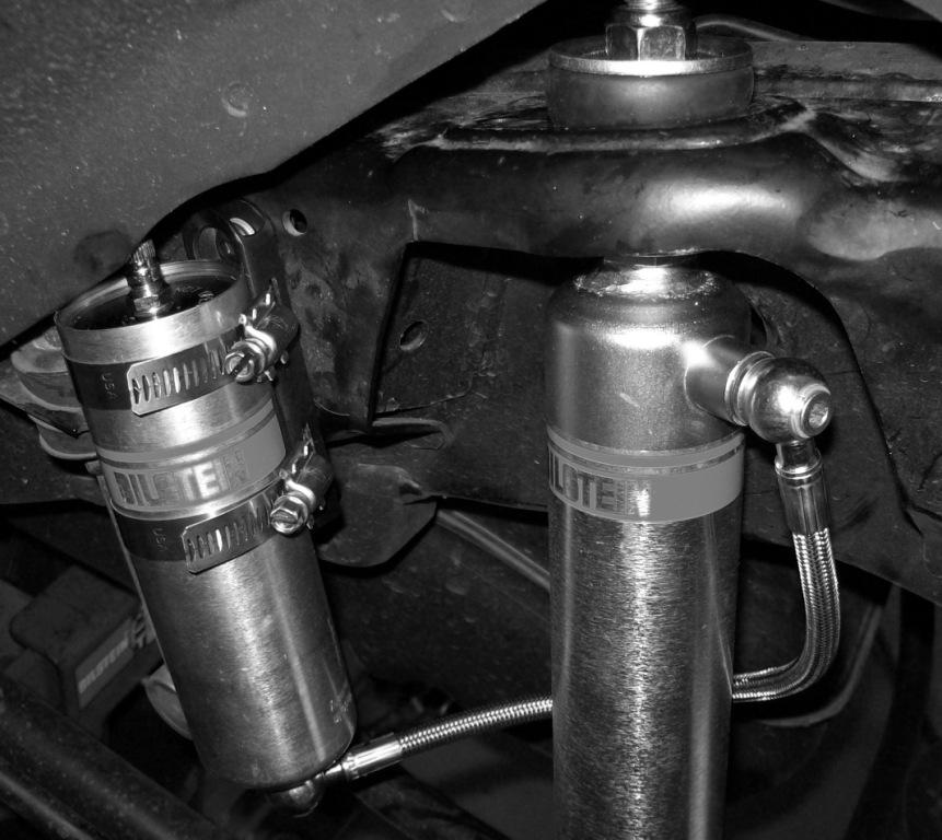 R. Tighten the lower mount fasteners to the vehicle manufacturer s service manual torque specification. Tighten the locknut on the upper mount until it bottoms out on the last thread. S.