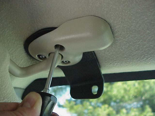 in position (see figure 7). Attach the driver's side bracket to the headliner with the inner torx screw (as shown in figure 8).