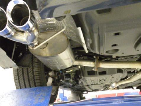 Note: Leave the protective cover on the exhaust tips during installation to