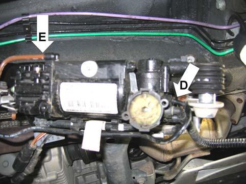 Reinstall black air line -D- to front of air supply unit Reinstall brown air line -E- to side of cylinder head Check air lines by pulling to make certain they are locked into connectors Carefully