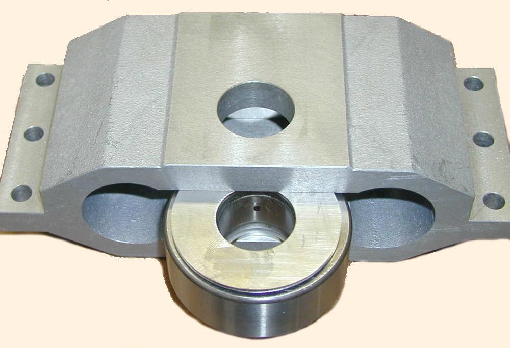 Place cam follower bearing (67) and one follower washer (64) each side of bearing into middle carriage (61) so that the bearing cross hole faces to the back of the block. 3.