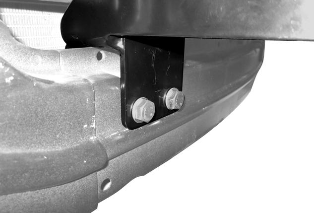 Using the Mounting Bracket holes as a template, drill through the bumper beam in these 4 locations. Figure 7.