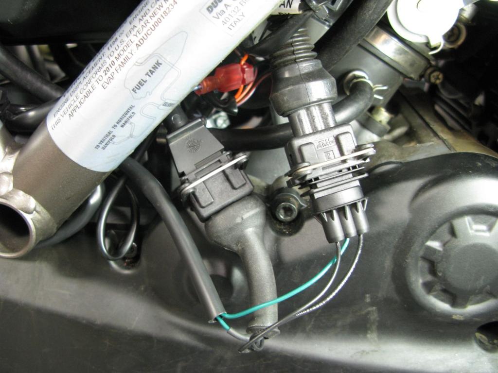 Photo 7 5. Locate the Crank Position Sensor (CPS) connectors (found between cylinders below air box).
