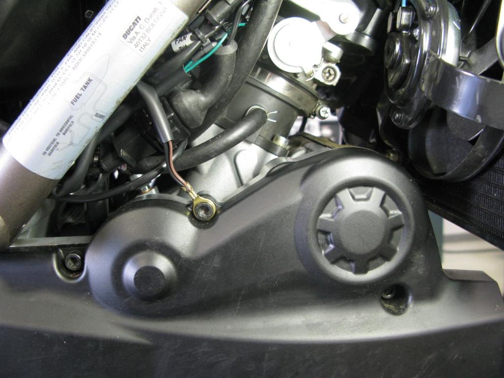 Insert T-Tap connector attached to the blue wire on the Bazzaz harness into the scotchlok connector and re-connect the factory harness connector to the throttle bodies (photo 11).