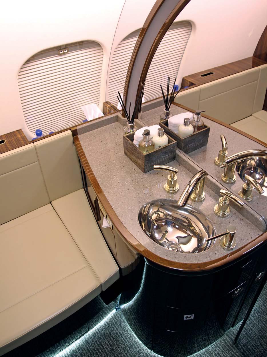 The aft area includes a lavatory, a vanity and an aft wardrobe.