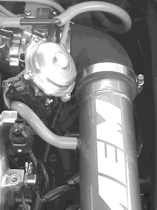 l. Install the AEM filter on to the end of the inlet tube. Push the filter on around 2 inches over the inlet pipe and install the #48 hose clamp to secure the filter on to the inlet pipe.