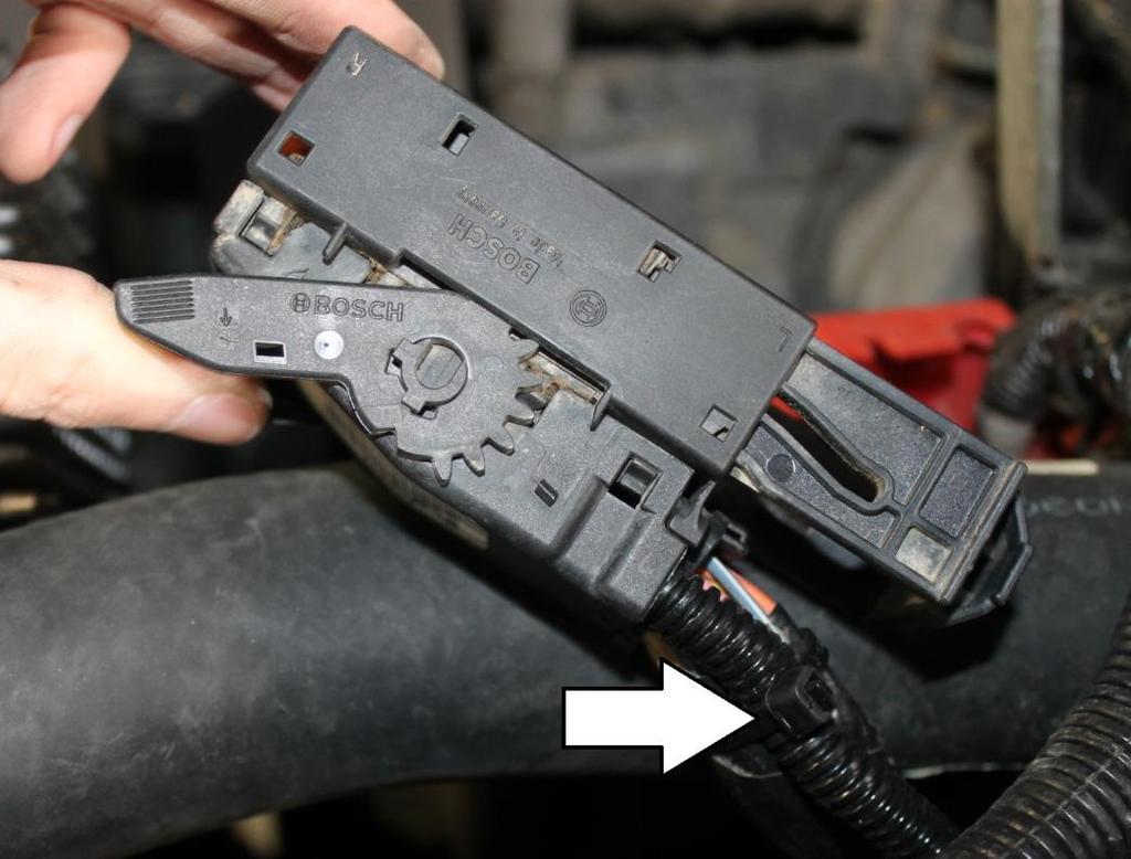 Install the top large connector back on the ECM, followed by the lower small connector.
