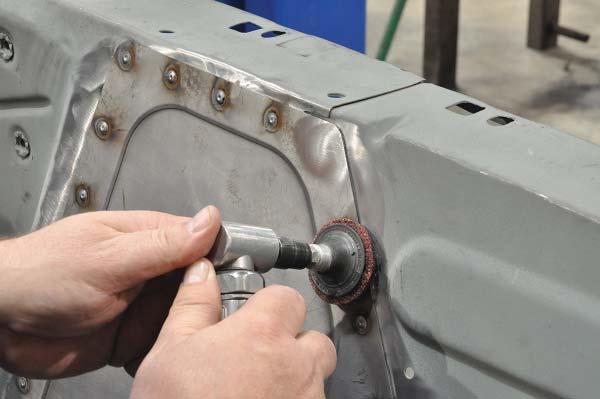 55. Continue plug welding the remaining rosette holes along the weld fl anges, delete