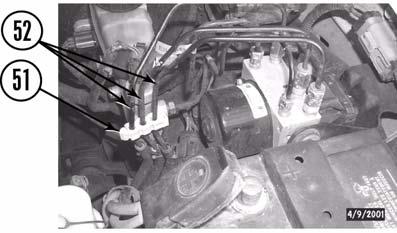 If possible, install three ABS lines (52) in clip (53) on driver side shock tower