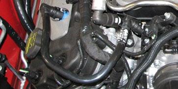 16. Loosen the throttle body and air box cover worm clamps then remove and discard the inlet tube assembly.