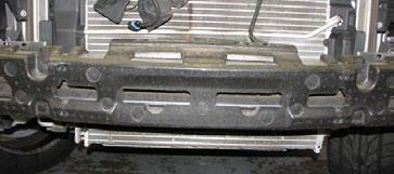 36. Use a panel puller to remove the four pins retaining the foam bumper, then set them and the bumper aside. 39.