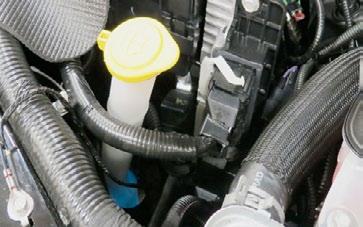 84. Install the stock driver side PCV hose onto the passenger side PCV fitting and attach it to the passenger side of the