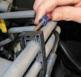 Remove the brake booster hose from the