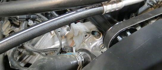The water pump bolt provision and the cylinder head provision are the mounting points for the recovery tank.