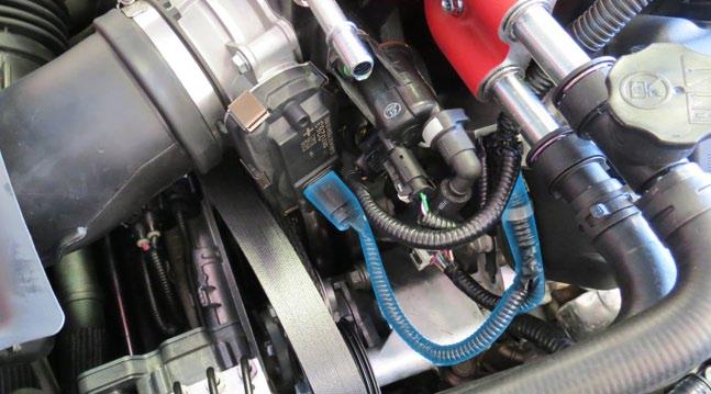 Connect the factory brake booster hose to the fitting on the