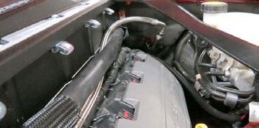 Connect the supplied fuel crossover hose to the passenger side fuel rail and route the crossover behind the