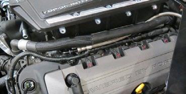 Install fuel rails using four (4) SHCS M6 x 16mm from Bag #1 and connect the crossover to the driver side