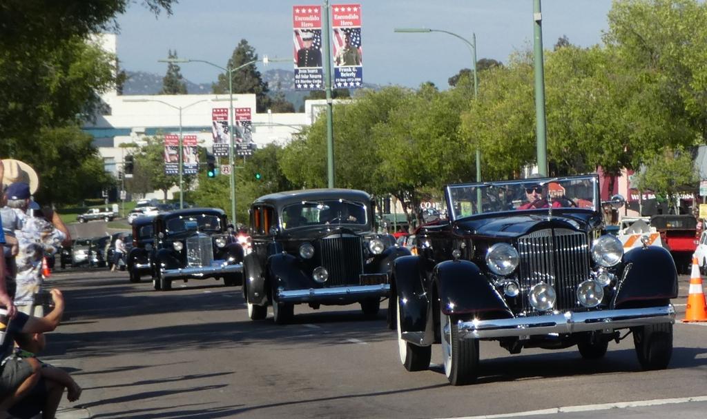 The form-up area is nice long semi-deserted street where the cars can be arranged in year order. The oldest car leads the parade; this year it was Paul Erlich's 1925 7-Passenger limo.