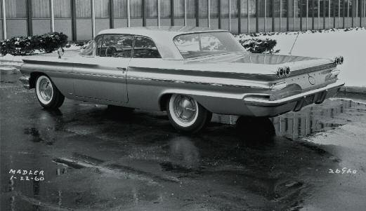 That car was seen driving around the Detroit area that year. A second car was built in 1960, using the very same roof from the black '59. That car was actually built as a driver for Knudsen.