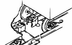 Press down on the lock release to open the coupler, then push the cars toward each other until
