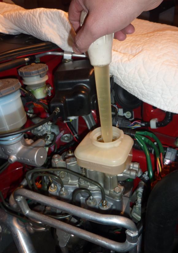 More brake fluid to remove: Using a turkey baster, remove as much as possible from the ALB/ABS reservoir. Then, put a good quality lint free shop towel in the reservoir to absorb the rest.