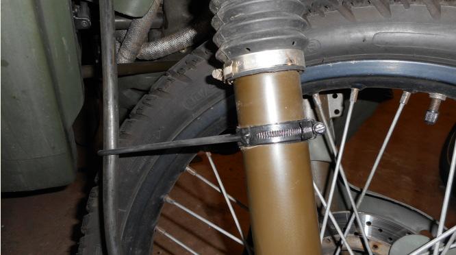 1. Remove the Disk Guard bolt (10mm spanner) and remove the plastic guard from the bike 2.