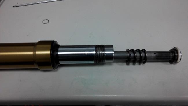 Step 13. Remove the shaft and the top-out spring. Step 14.