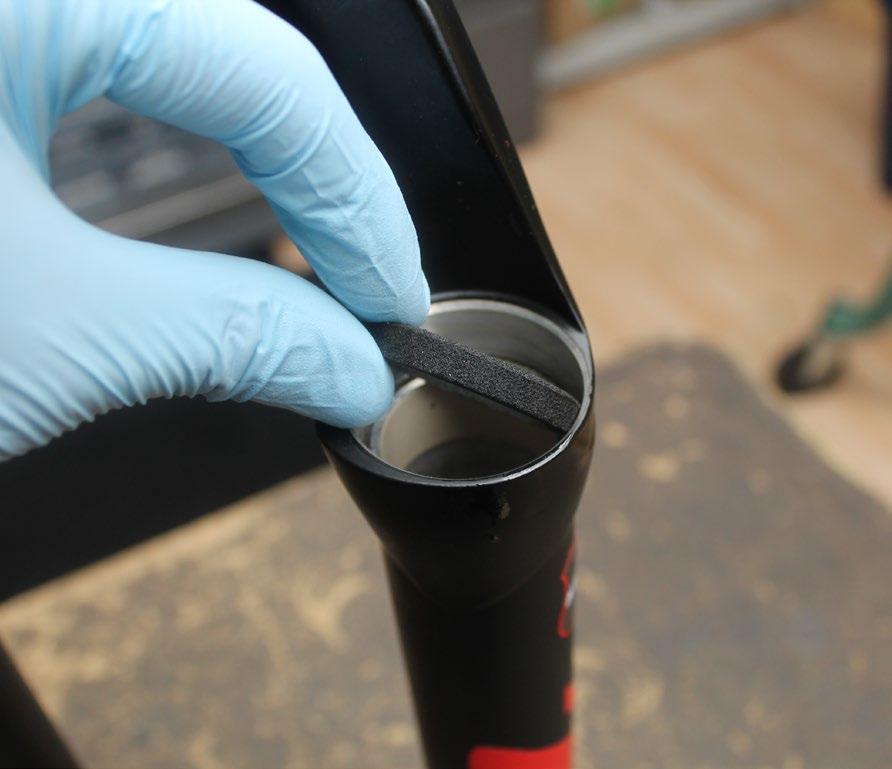5 Using a downhill tire lever or similar tool, gently pry the dust seals