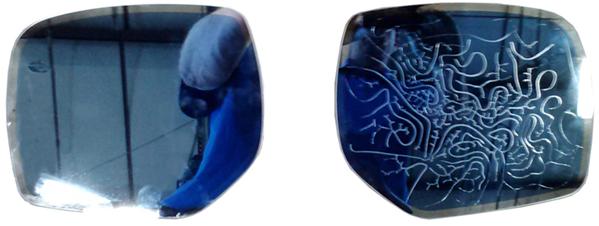 cases where the appearance of the exterior Auto Dim mirror glass has changed to having a permanent dark blue or yellowish tint (sometimes also with a pattern) as shown in the example photos below.