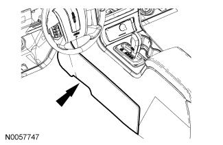 Installation All vehicles 1. Install the selector lever cable, position the grommet in place and install the 2 nuts. Tighten to 10 Nm (89 lb-in). 2. Install the center console side cover. 3.